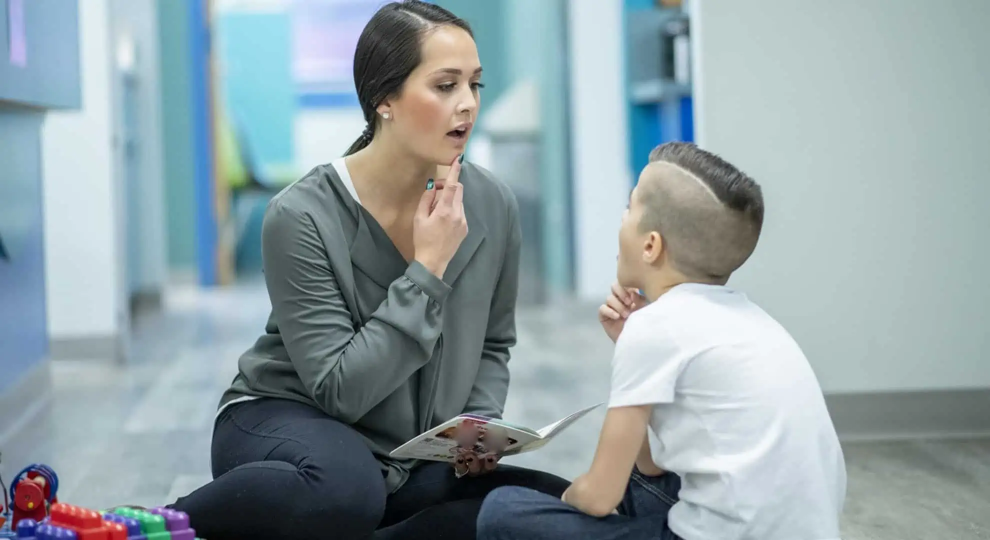 speech therapist working with child therapy pro