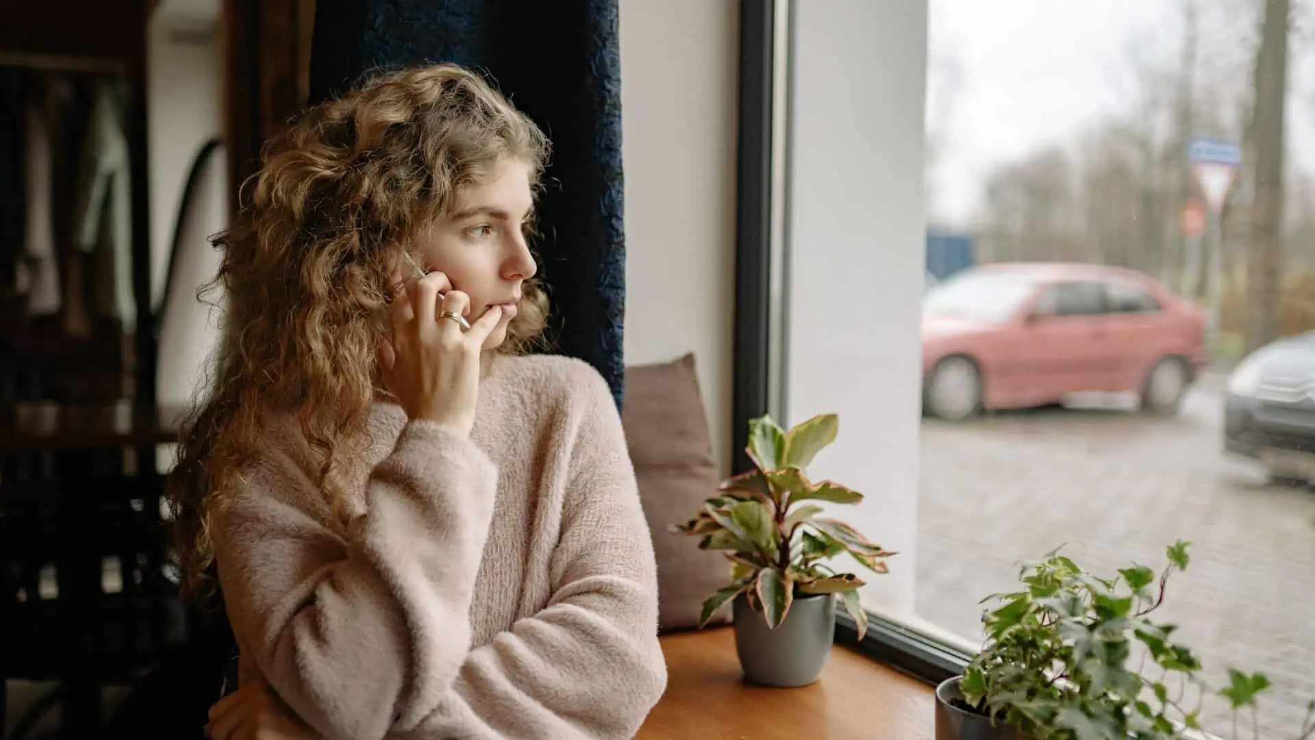 woman on phone accessing mental health services therapy pro online